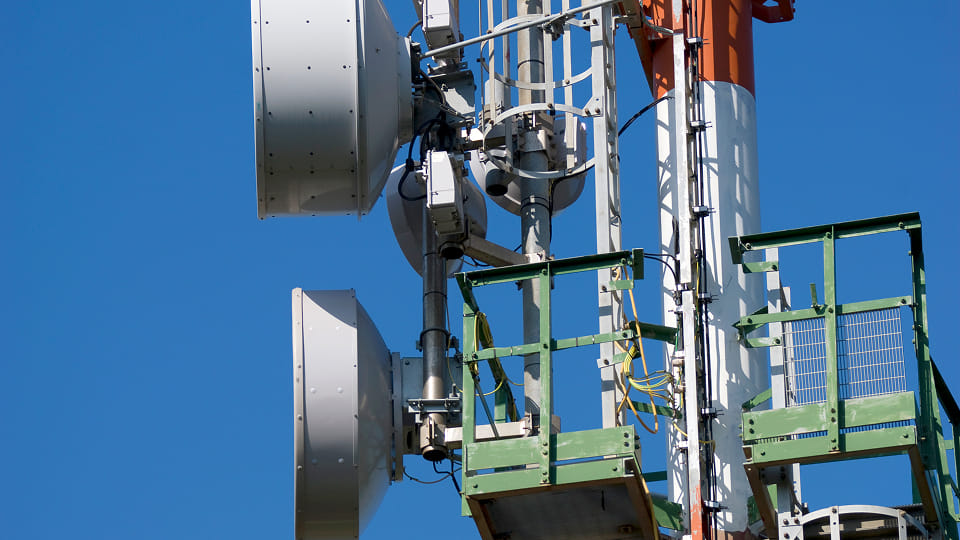 A cell phone tower with two antennas